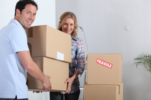 Boxes and furniture being loaded for a man with van service