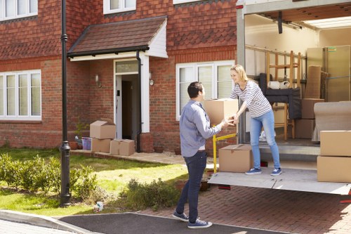 Careful unloading of household items from a van