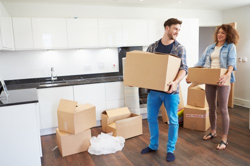 Sorting cardboard, metals, and household waste for recycling in Ruislip